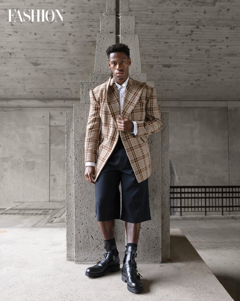 Jacket, $2,085, top, $645, and shorts, $755, Willy Chavarria. Shoes, $1,090, Vivienne Westwood at Ssense. Rings, $140 each, Derep Studios at U3. Socks, $6, Uniqlo.