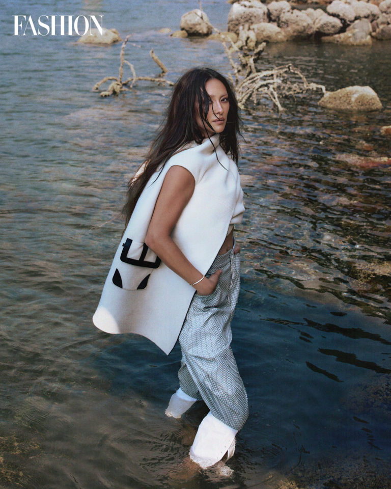 Top, $13,300, pants, $3,500, and bracelet, $25,900, Louis Vuitton.